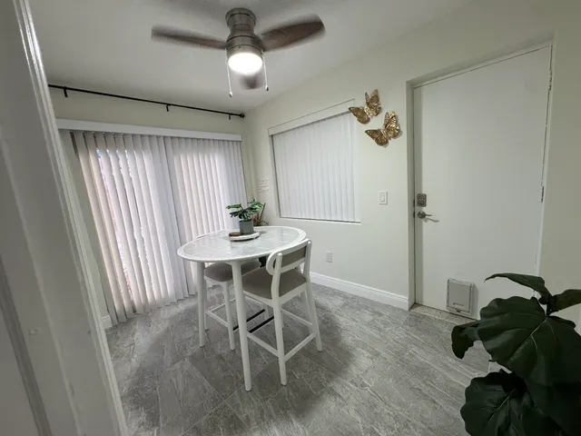 a dining room with wooden floor and breakfast area