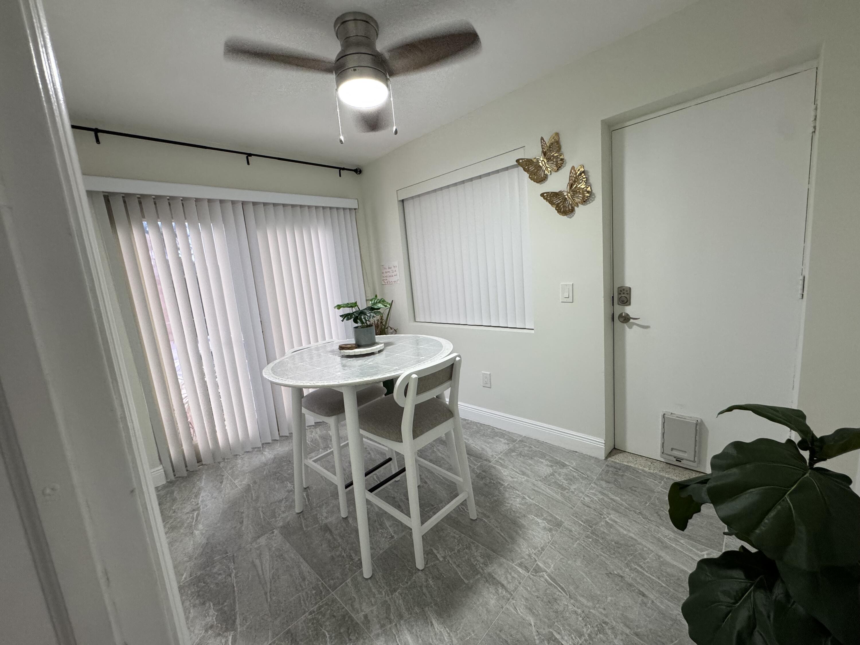 2664 Exuma Road West Palm Beach, FL 33406 - Photo 5 of 5 a dining room with wooden floor and breakfast area