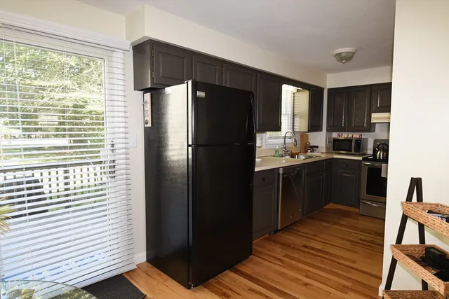 a kitchen with a refrigerator and a stove