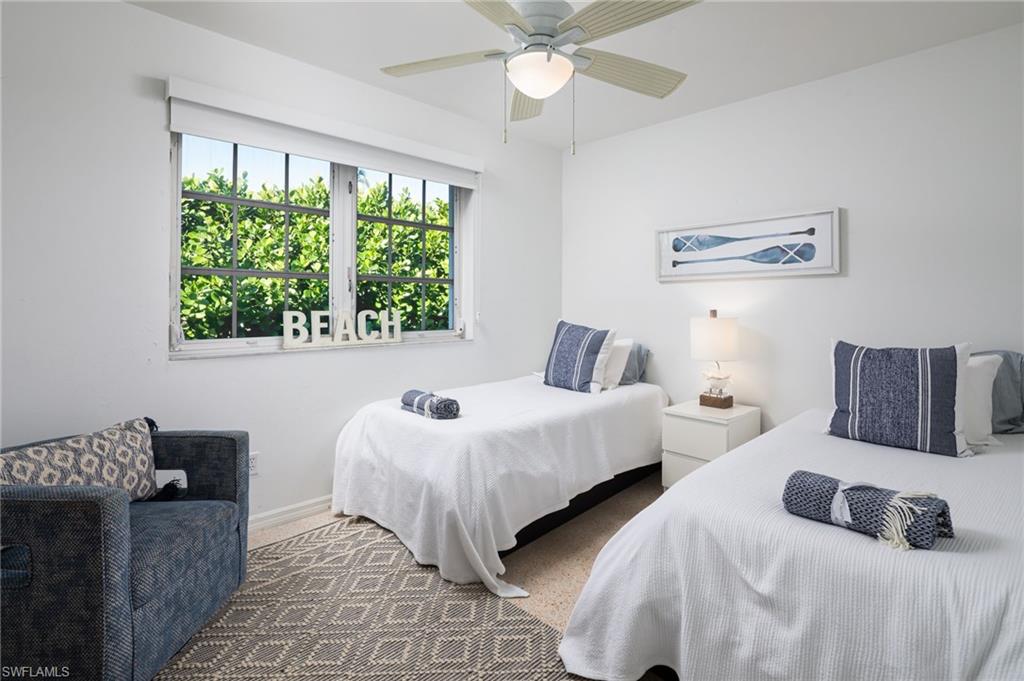 339 4th Avenue North Naples, FL 34102 - Photo 21 of 48 a bedroom with two beds and a large window