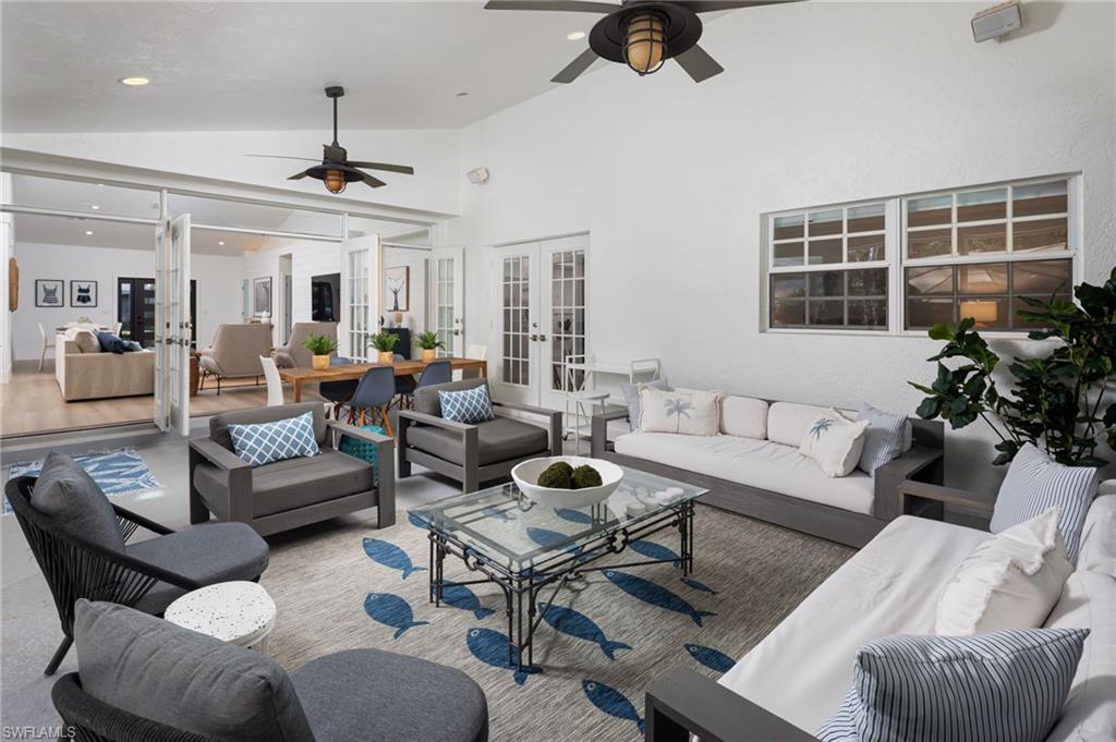 339 4th Avenue North Naples, FL 34102 - Photo 29 of 48 a living room with furniture and a large window