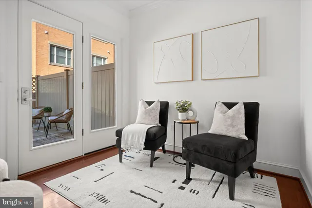 a view of a patio with table and chairs and potted plants