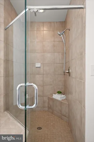 a view of a hallway with wooden floor and entryway