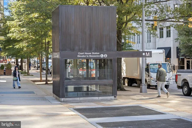 a view of a building with a outdoor seating