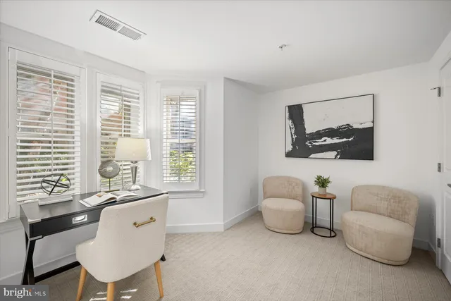 a view of a livingroom with furniture and windows