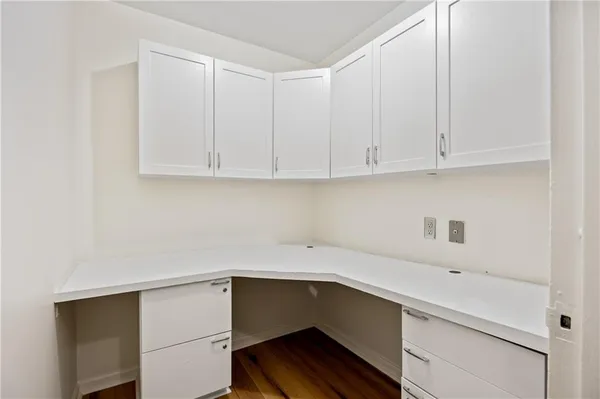 a view of cabinets with wooden floor