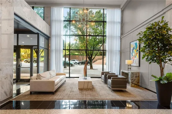 a living room with furniture and a large window