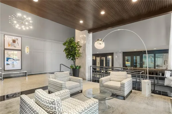 a living room with furniture and a large window