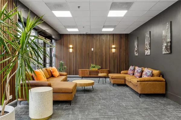 a living room with furniture and a large window