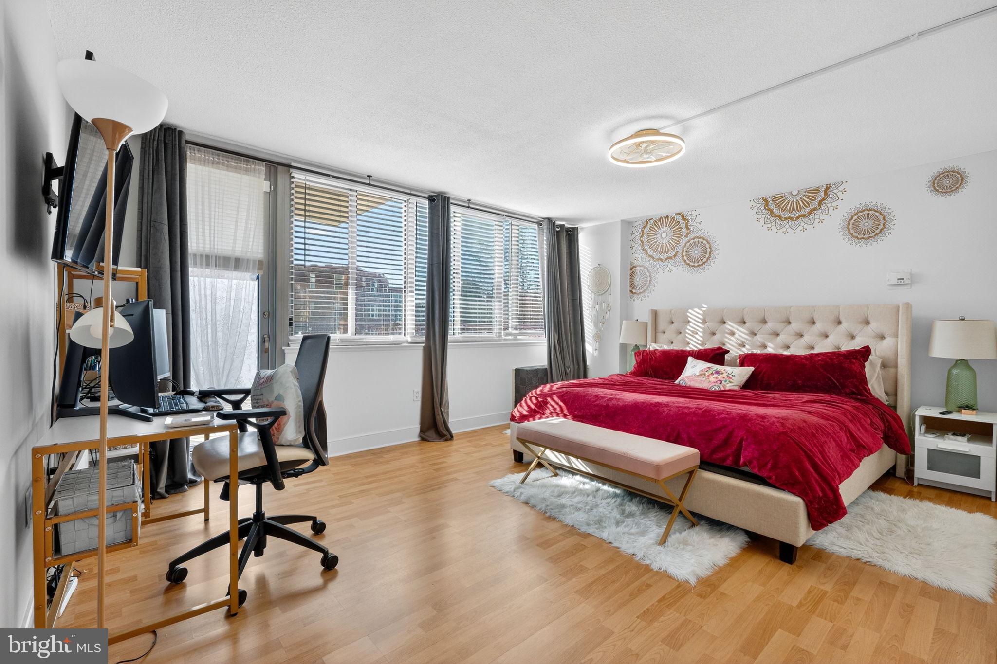 1220 Blair Mill Road, Unit 205 Silver Spring, MD 20910 - Photo 14 of 31 a bedroom with a bed and a desk