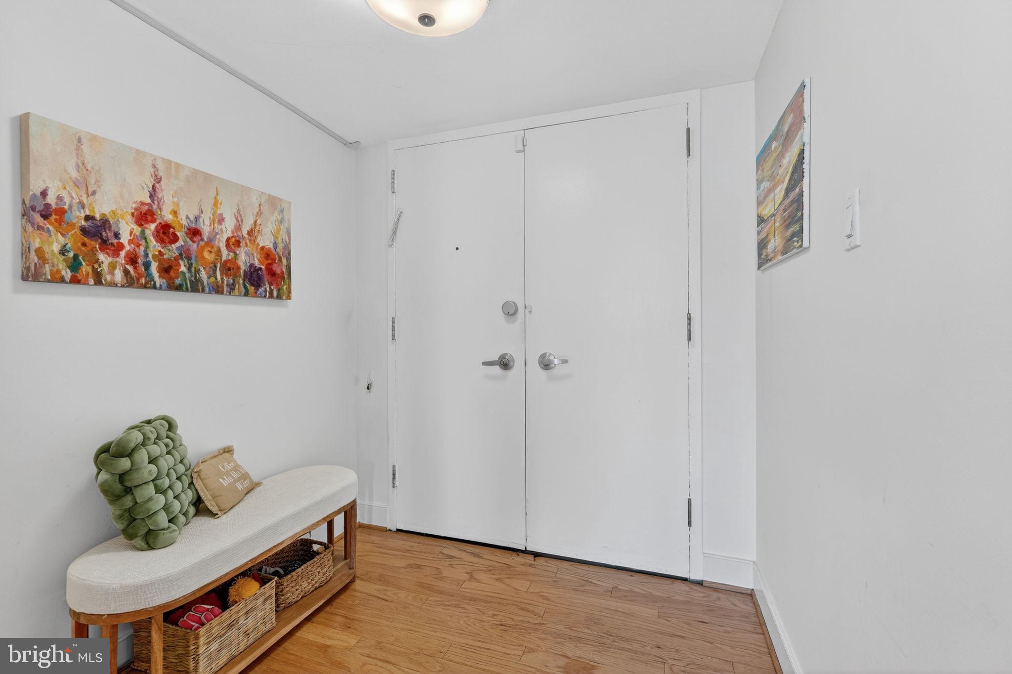 1220 Blair Mill Road, Unit 205 Silver Spring, MD 20910 - Photo 21 of 31 a living room with furniture and a rug