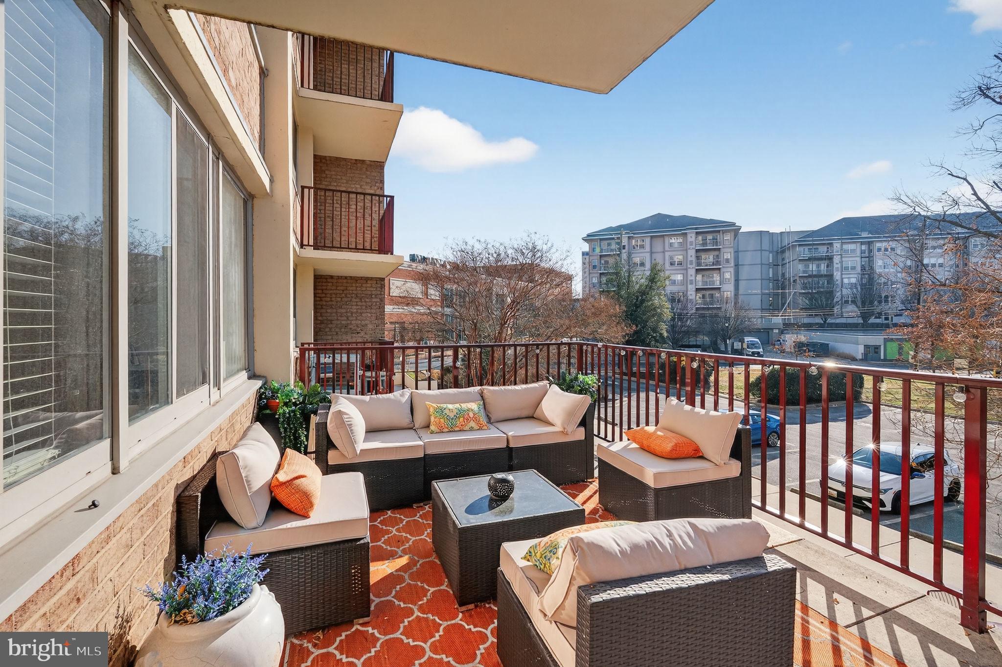1220 Blair Mill Road, Unit 205 Silver Spring, MD 20910 - Photo 28 of 31 a balcony with furniture and city view
