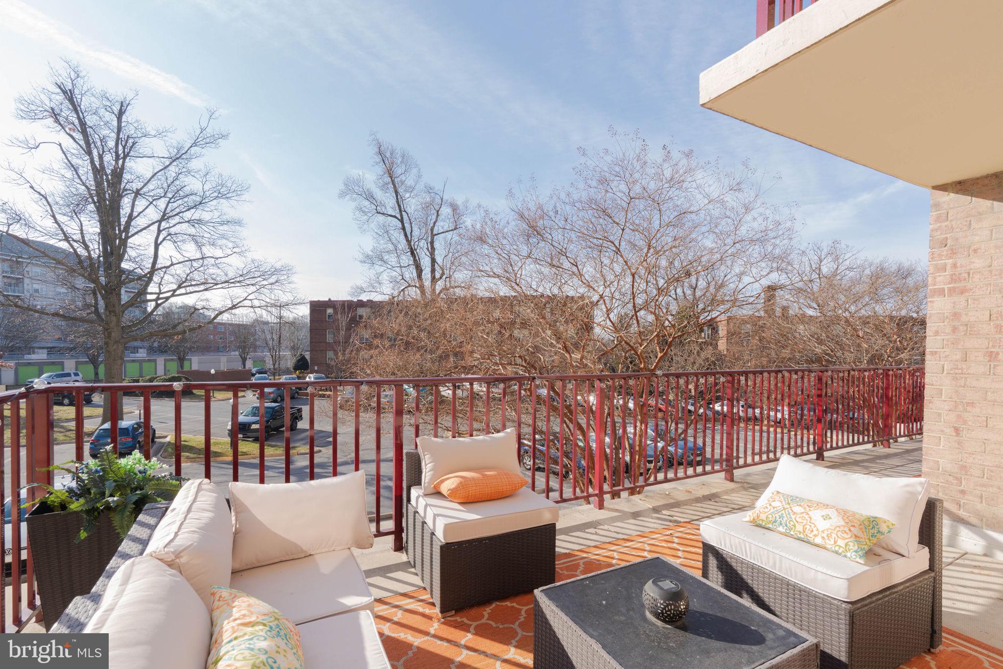 1220 Blair Mill Road, Unit 205 Silver Spring, MD 20910 - Photo 31 of 31 a view of a patio with couches chairs and wooden floor
