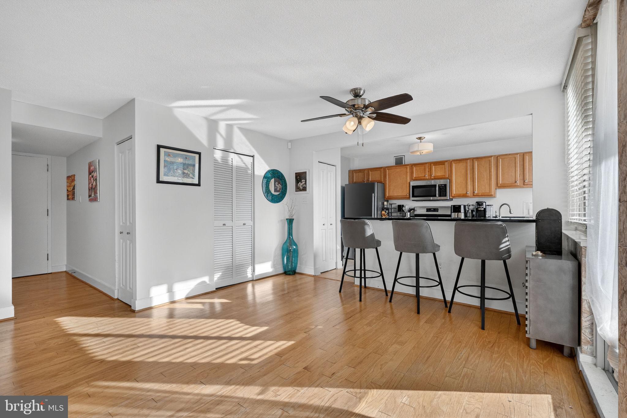 1220 Blair Mill Road, Unit 205 Silver Spring, MD 20910 - Photo 5 of 31 a living room with stainless steel appliances kitchen island granite countertop furniture and a kitchen view