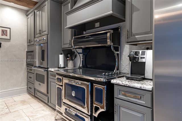 a kitchen with a stove and a microwave