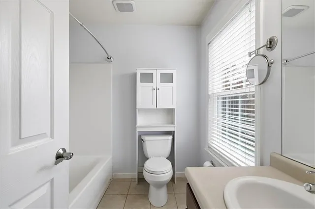 a bathroom with a toilet a sink and a bathtub
