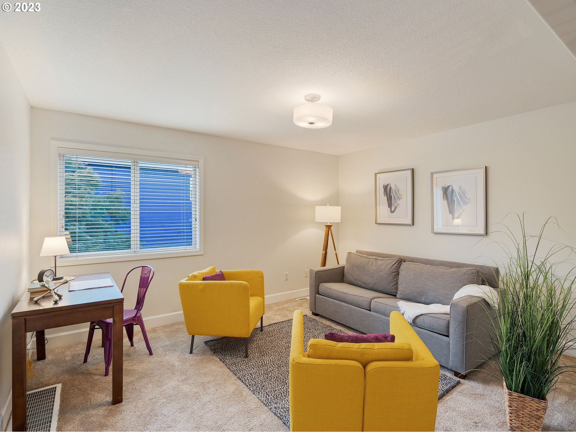 11320 Northwest Kearney Street Portland, OR 97229 - Photo 4 of 16 a living room with furniture and a potted plant