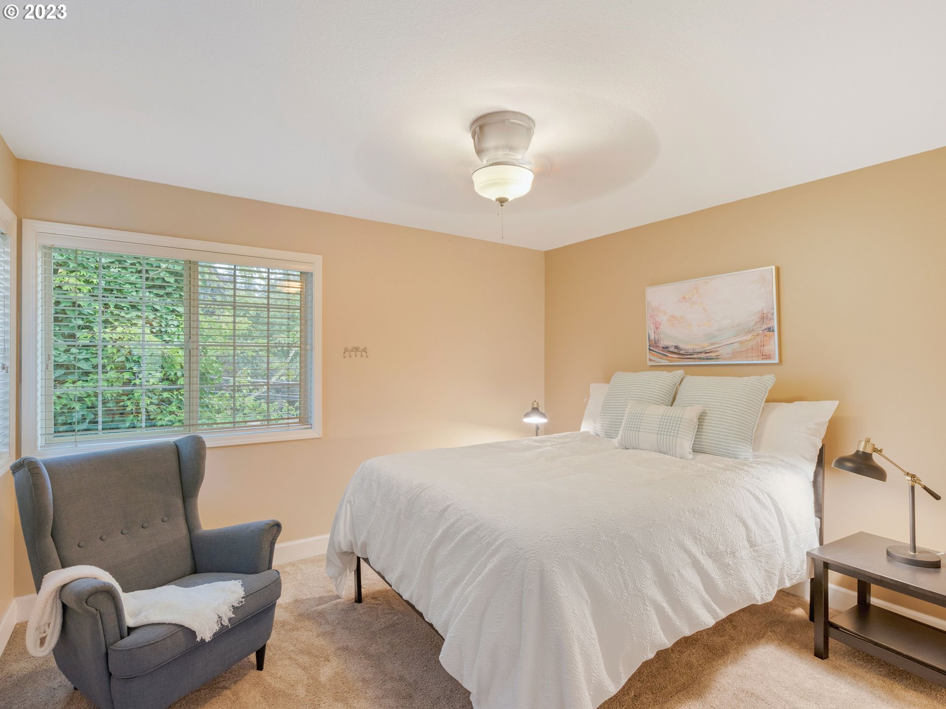 11320 Northwest Kearney Street Portland, OR 97229 - Photo 6 of 16 a bedroom with a bed and a couch