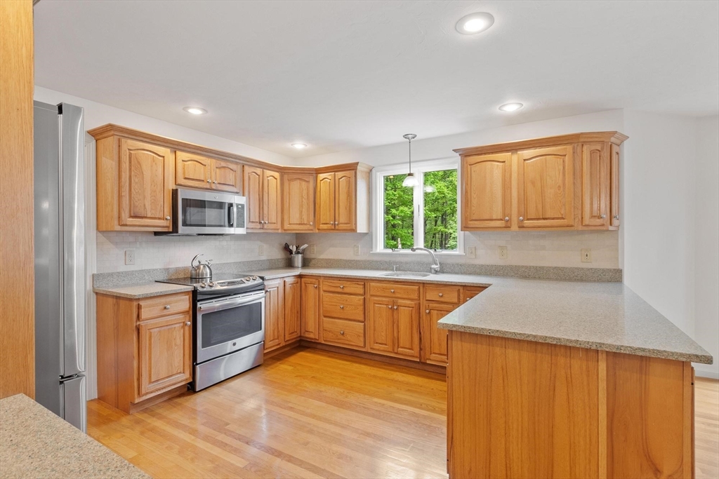 94 Turner Road Townsend, MA 01469 - Photo 6 of 42 a kitchen with stainless steel appliances granite countertop refrigerator sink and stove