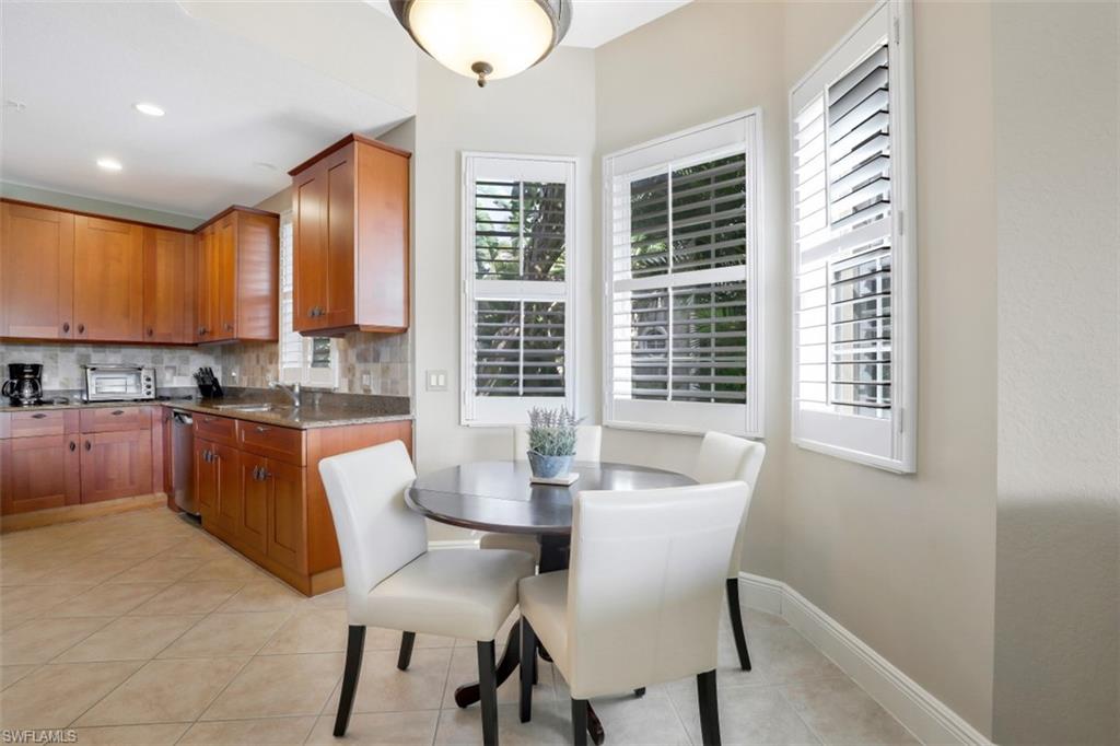 9224 Campanile Circle, Unit 101 Naples, FL 34114 - Photo 17 of 32 a view of a dining room with furniture window and outside view