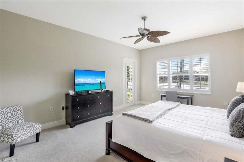 9224 Campanile Circle, Unit 101 Naples, FL 34114 - Photo 25 of 32 a bedroom with a bed and window
