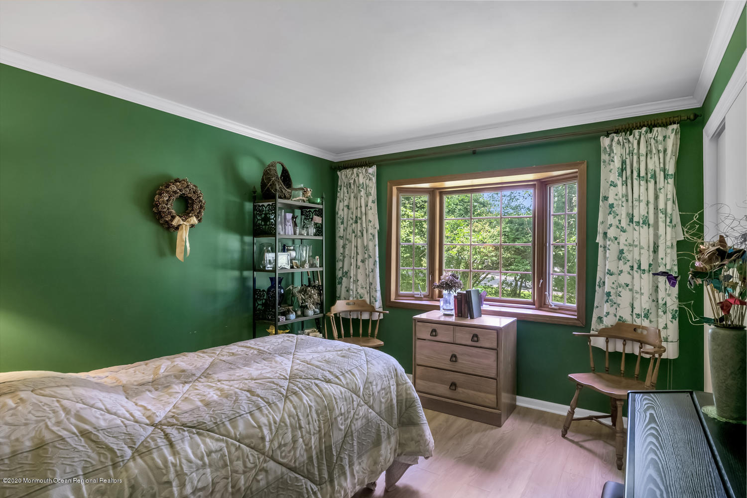 87 Bruce Road Red Bank, NJ 07701 - Photo 14 of 19 a bedroom with a bed and a bookshelf