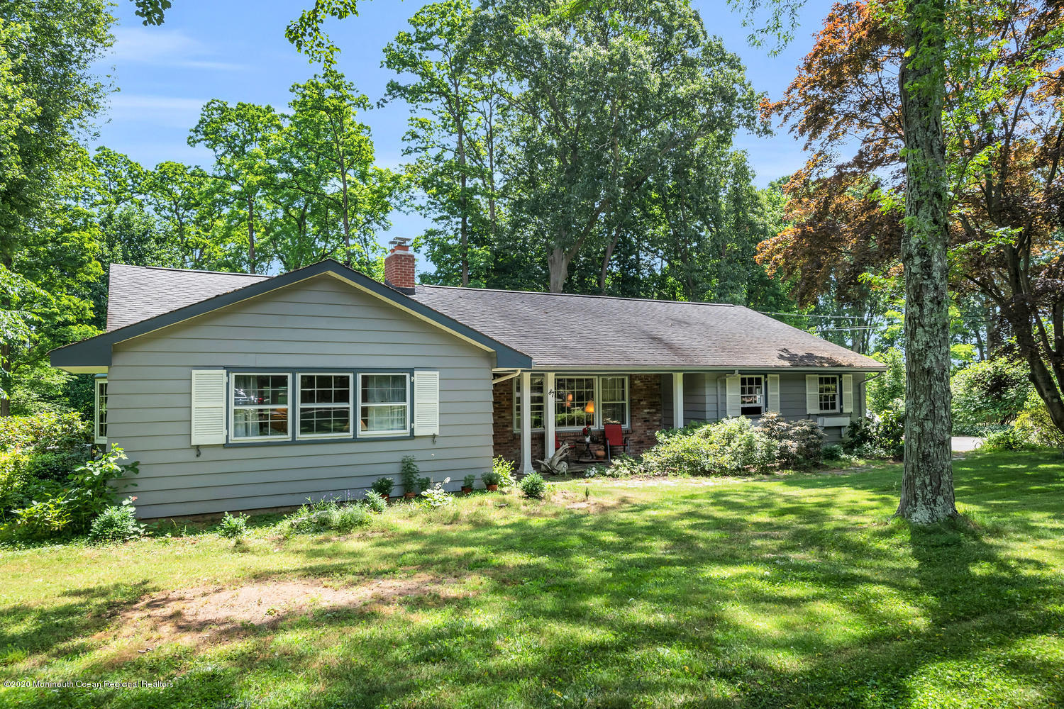 87 Bruce Road Red Bank, NJ 07701 - Photo 2 of 19 a house with trees in the background
