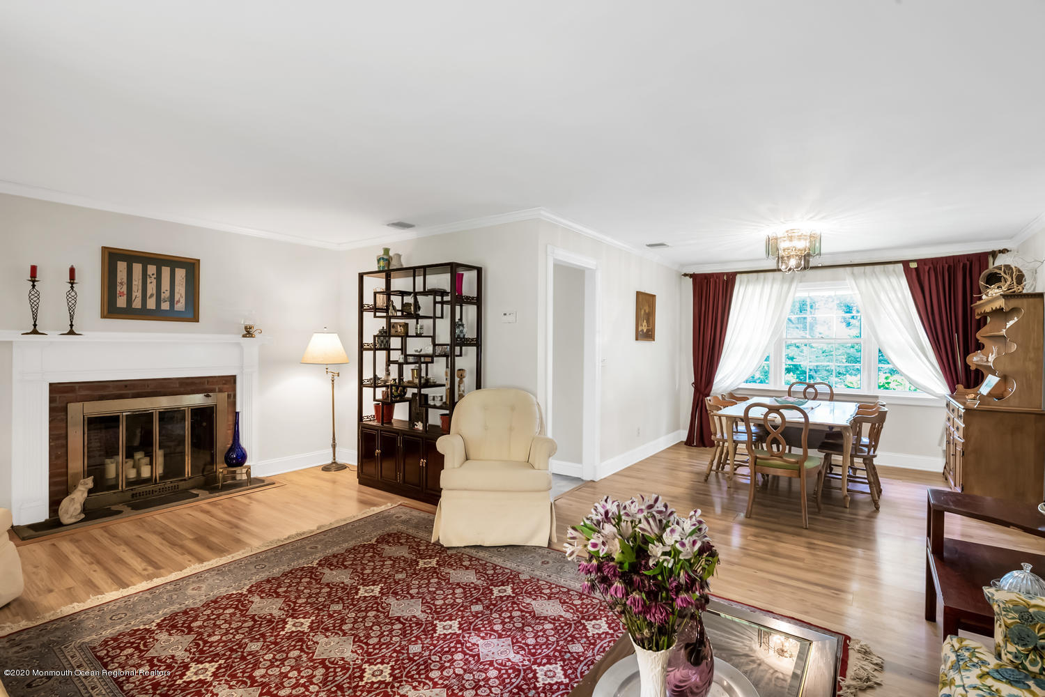 87 Bruce Road Red Bank, NJ 07701 - Photo 5 of 19 a living room with furniture fireplace and a large window