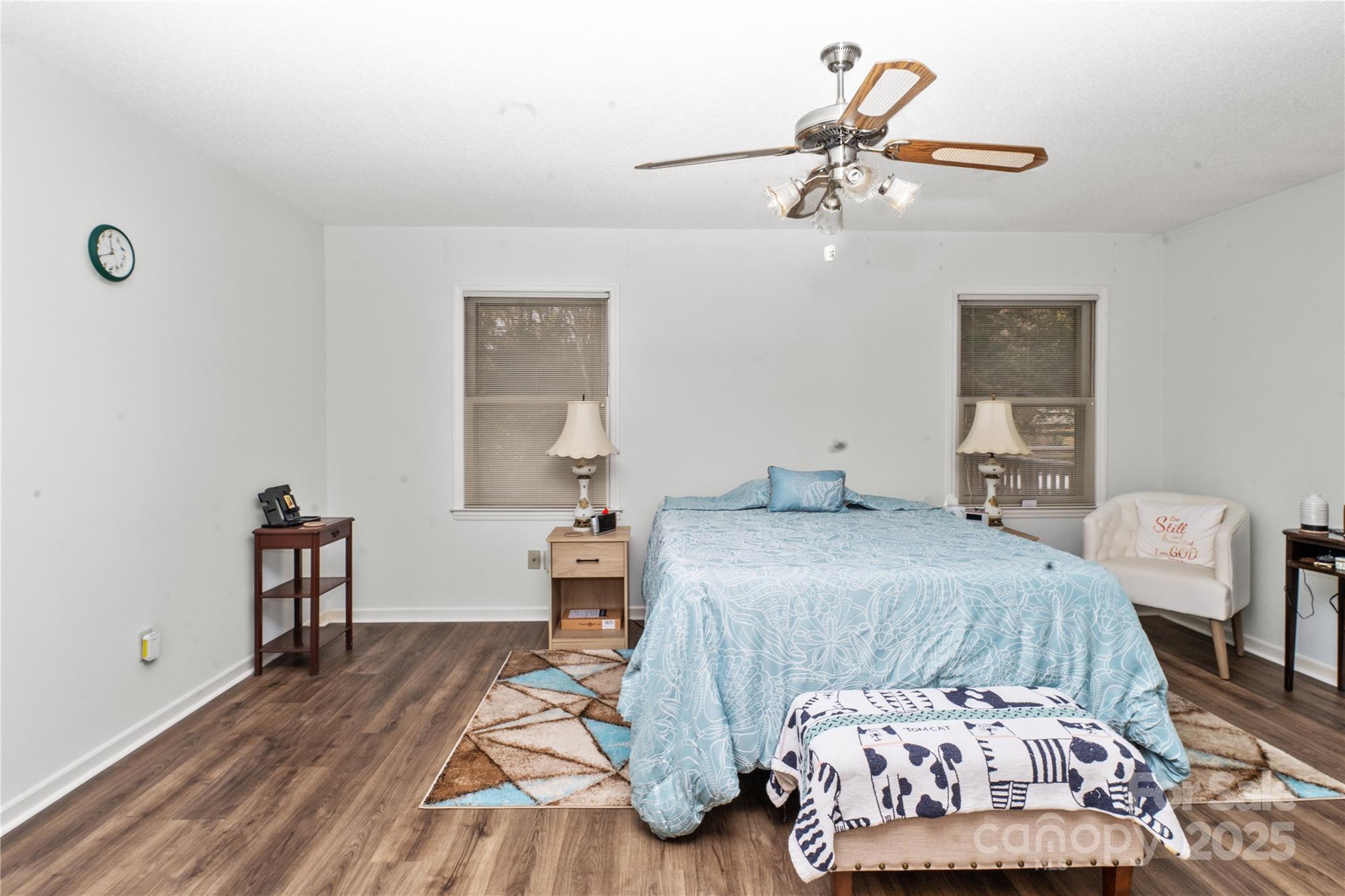 3614 McKee Road Charlotte, NC 28270 - Photo 11 of 29 a bedroom with a bed and a chandelier