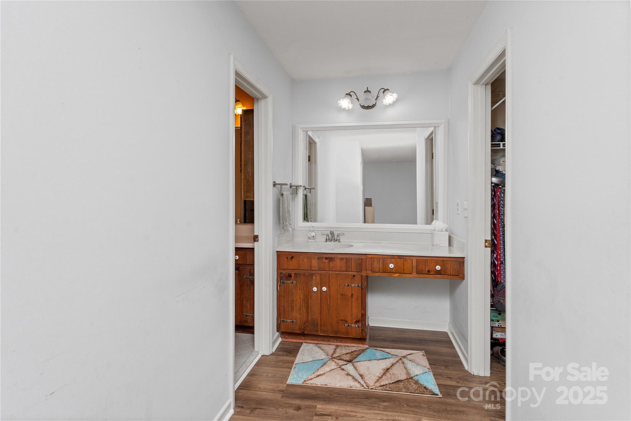 3614 McKee Road Charlotte, NC 28270 - Photo 14 of 29 a bathroom with a sink and a mirror