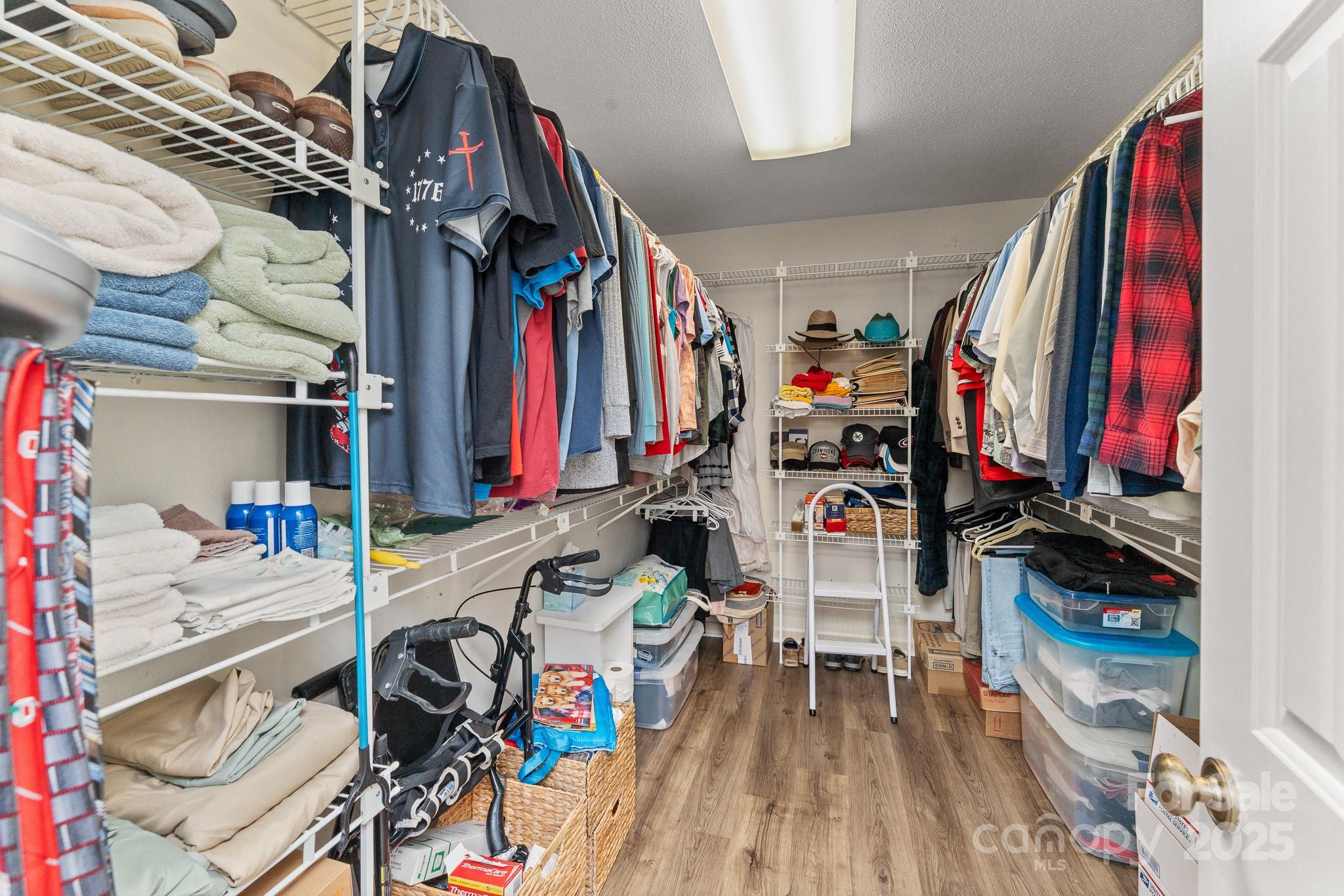 3614 McKee Road Charlotte, NC 28270 - Photo 15 of 29 a view of walk in closet with clothes and shoes