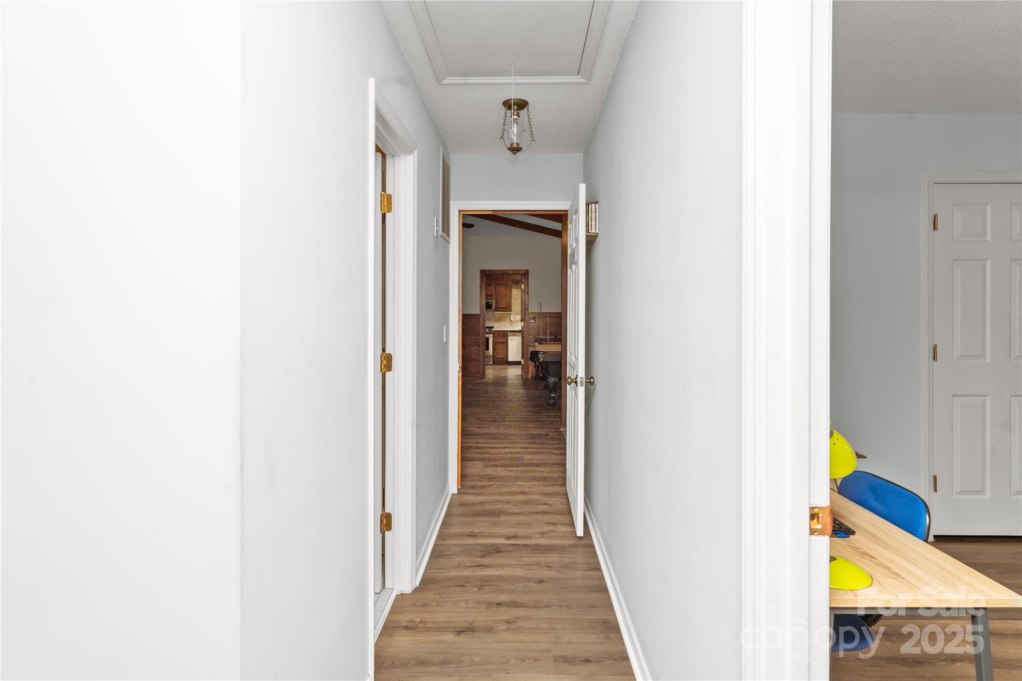 3614 McKee Road Charlotte, NC 28270 - Photo 20 of 29 a view of a hallway with wooden floor and front door