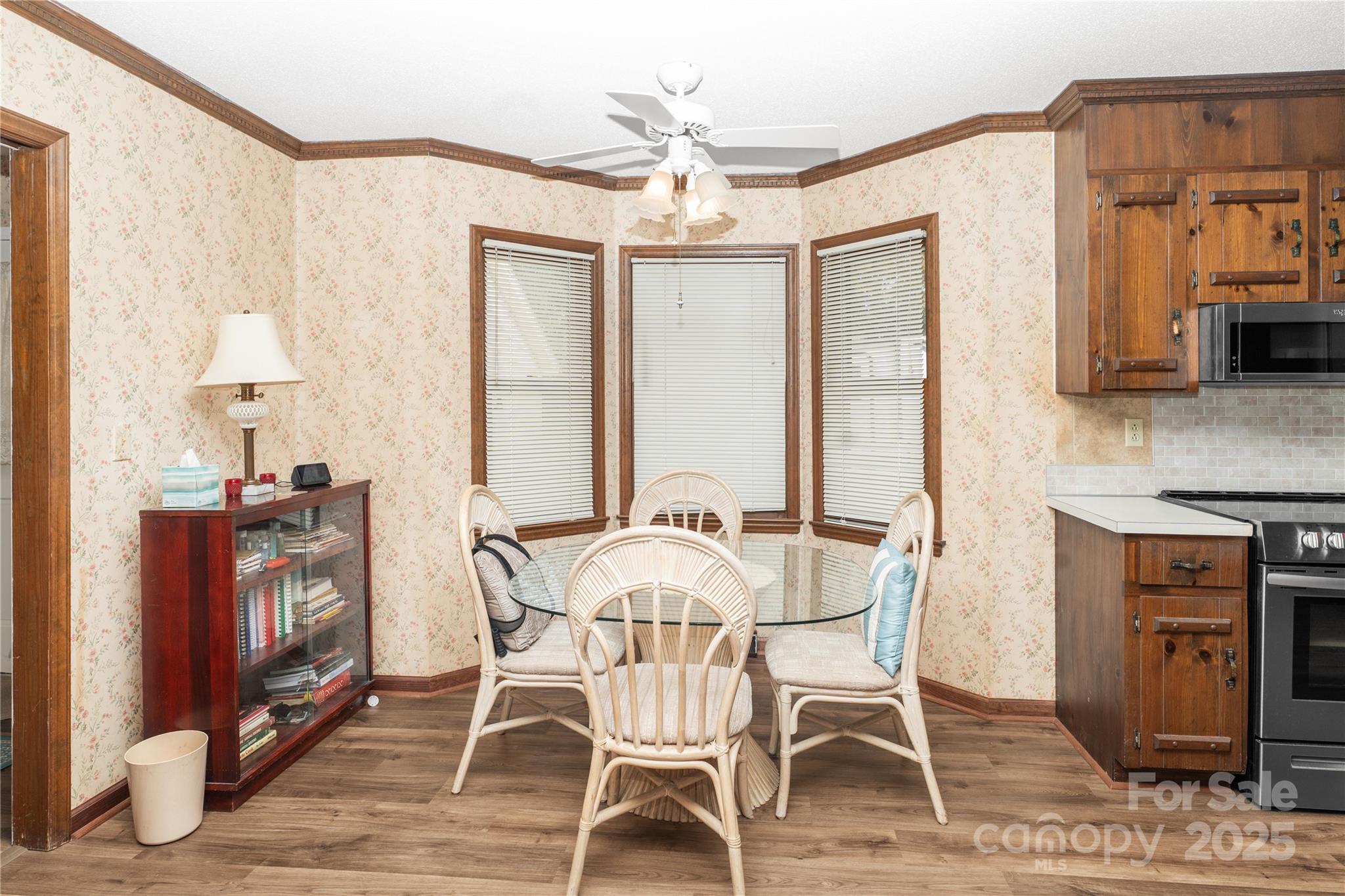 3614 McKee Road Charlotte, NC 28270 - Photo 8 of 29 a view of a dining room with furniture window and wooden floor