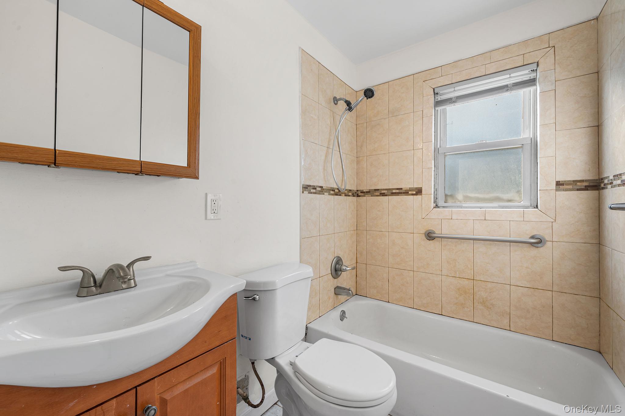 172-04 Amelia Road Queens, NY 11434 - Photo 12 of 25 a bathroom with a sink toilet and shower