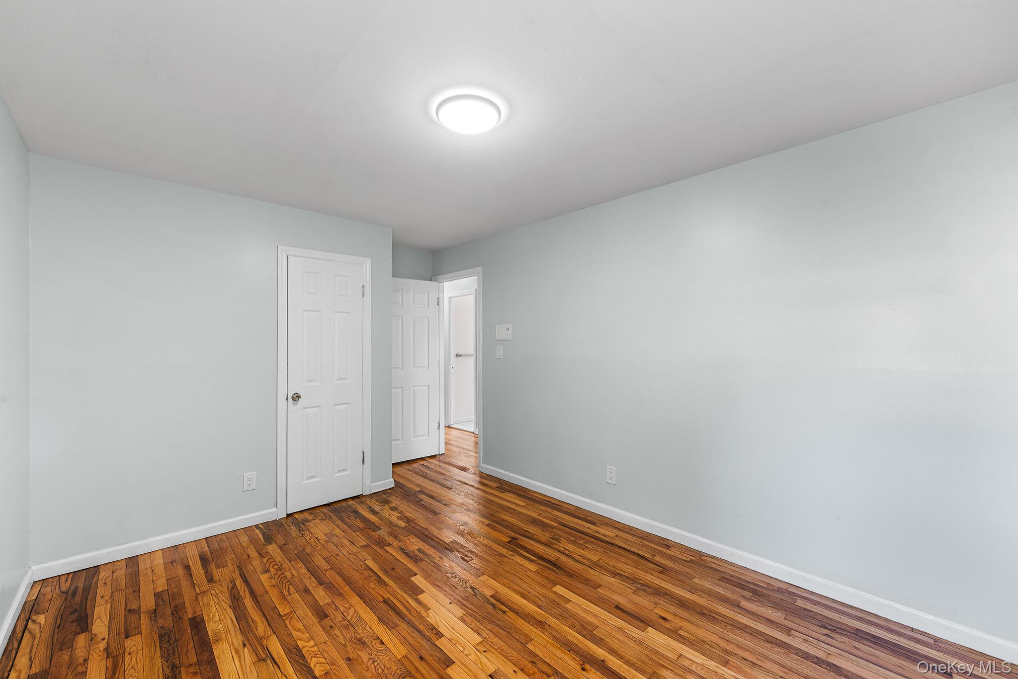 172-04 Amelia Road Queens, NY 11434 - Photo 15 of 25 a view of room with wooden floor