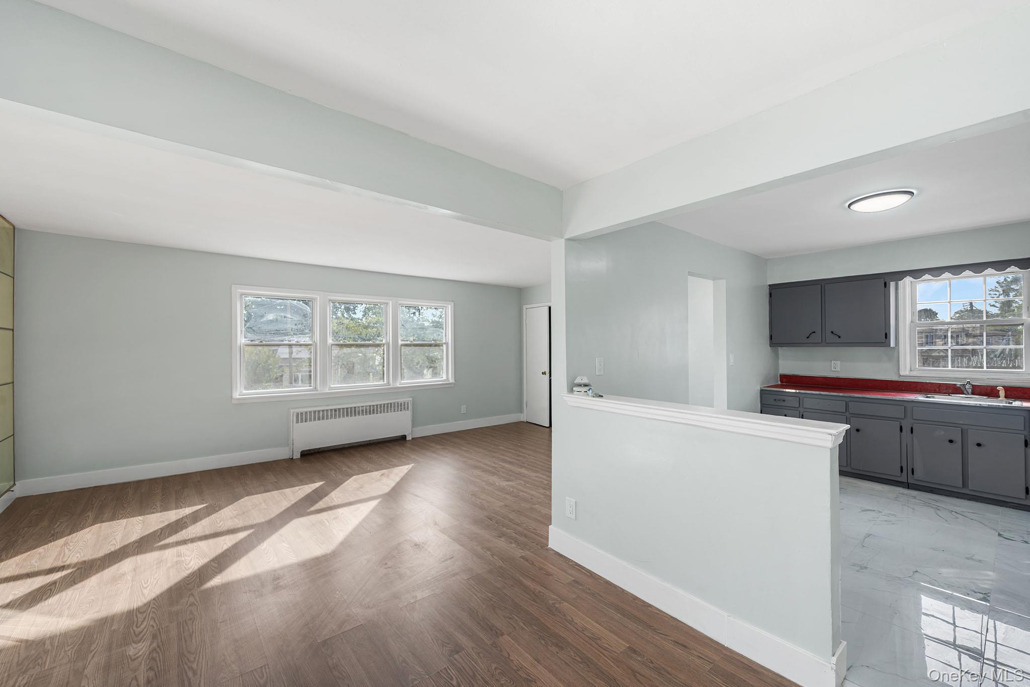172-04 Amelia Road Queens, NY 11434 - Photo 17 of 25 a view of kitchen with furniture and wooden floor