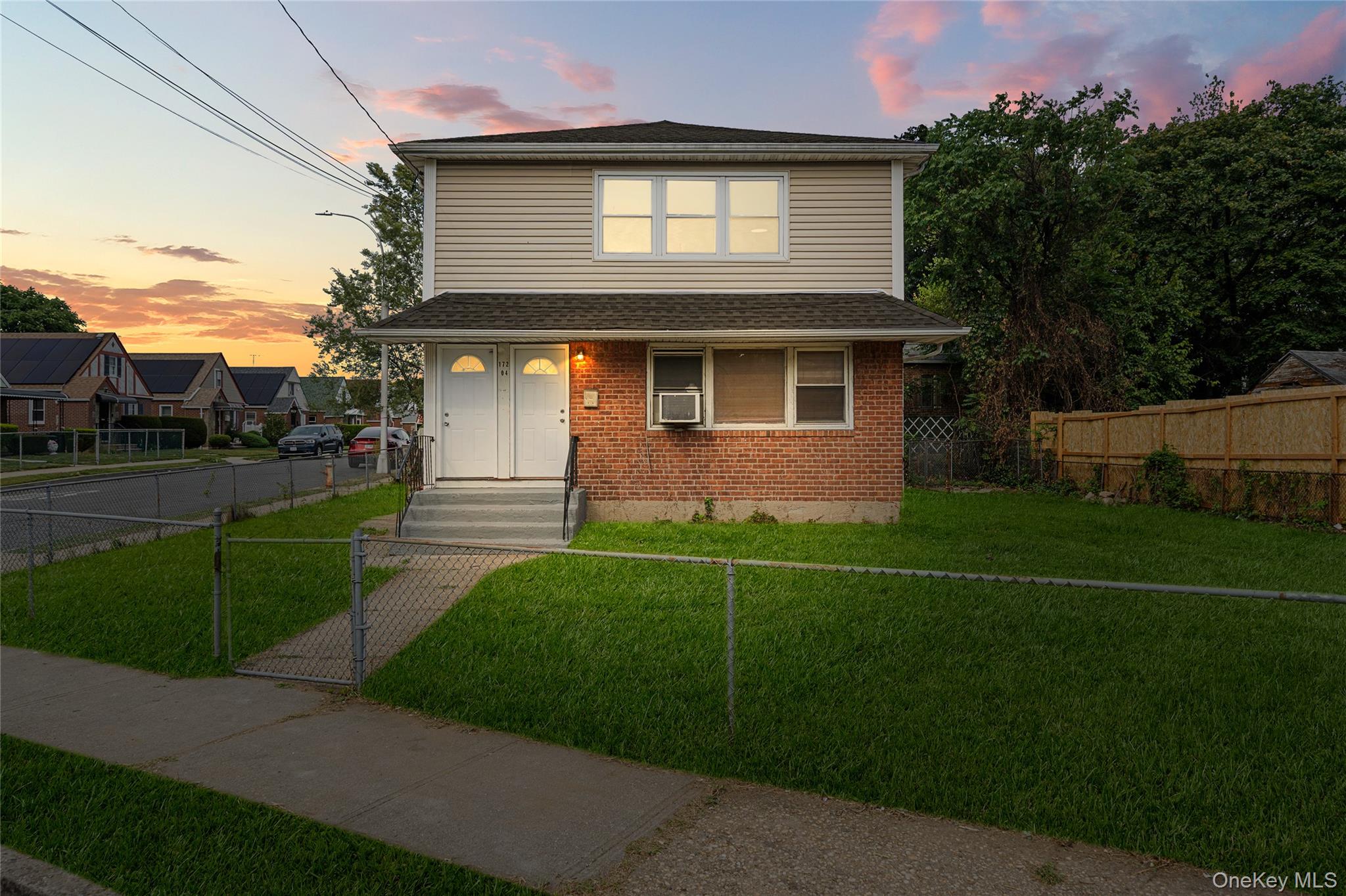 172-04 Amelia Road Queens, NY 11434 - Photo 2 of 25 a front view of a house with a garden