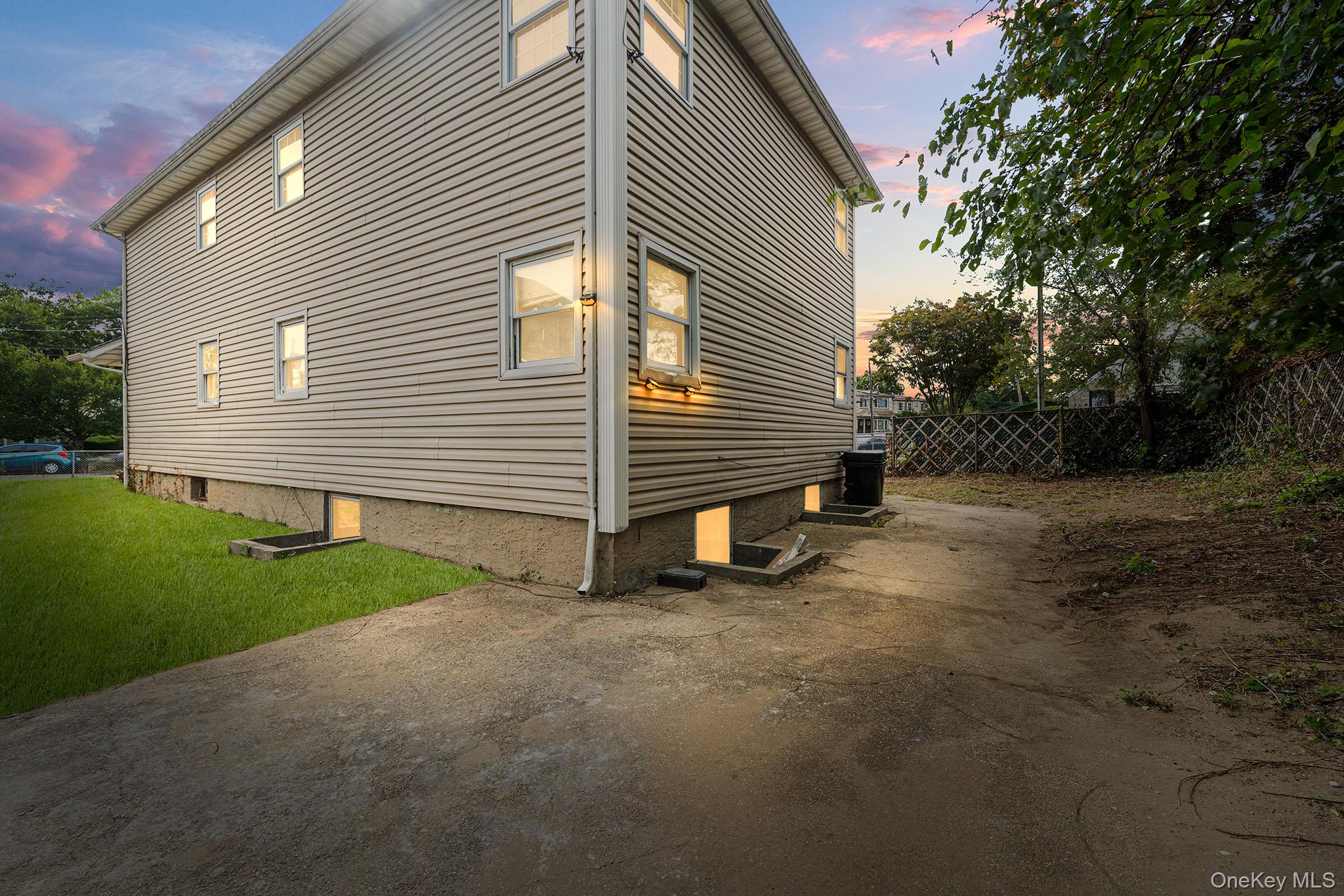 172-04 Amelia Road Queens, NY 11434 - Photo 24 of 25 a view of a house with a yard