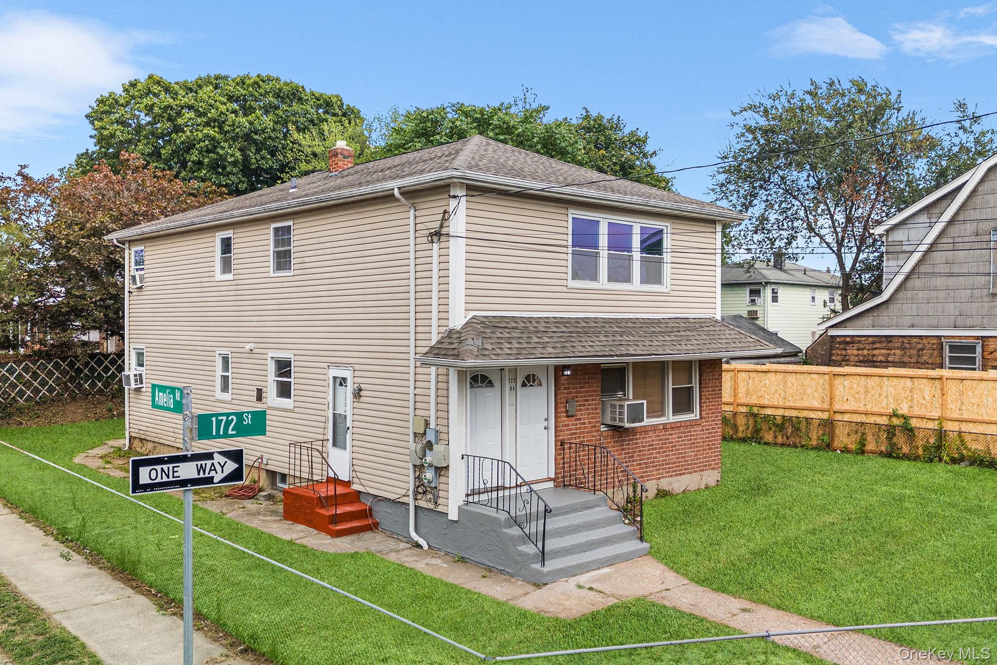 172-04 Amelia Road Queens, NY 11434 - Photo 3 of 25 a front view of house with yard and outdoor seating