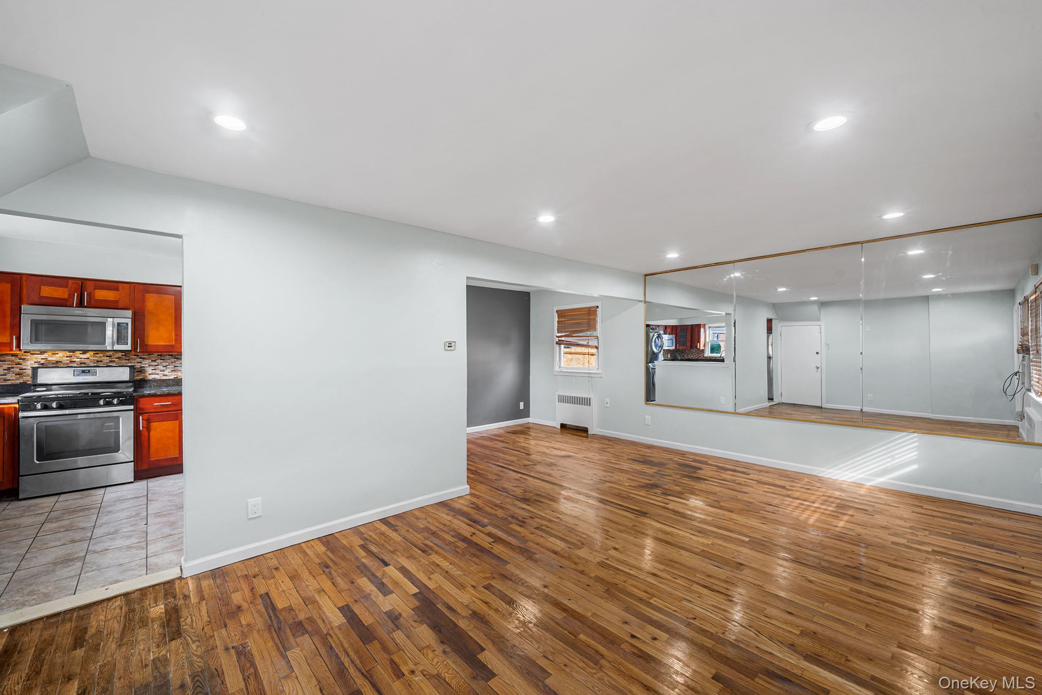 172-04 Amelia Road Queens, NY 11434 - Photo 9 of 25 a view of a livingroom with wooden floor