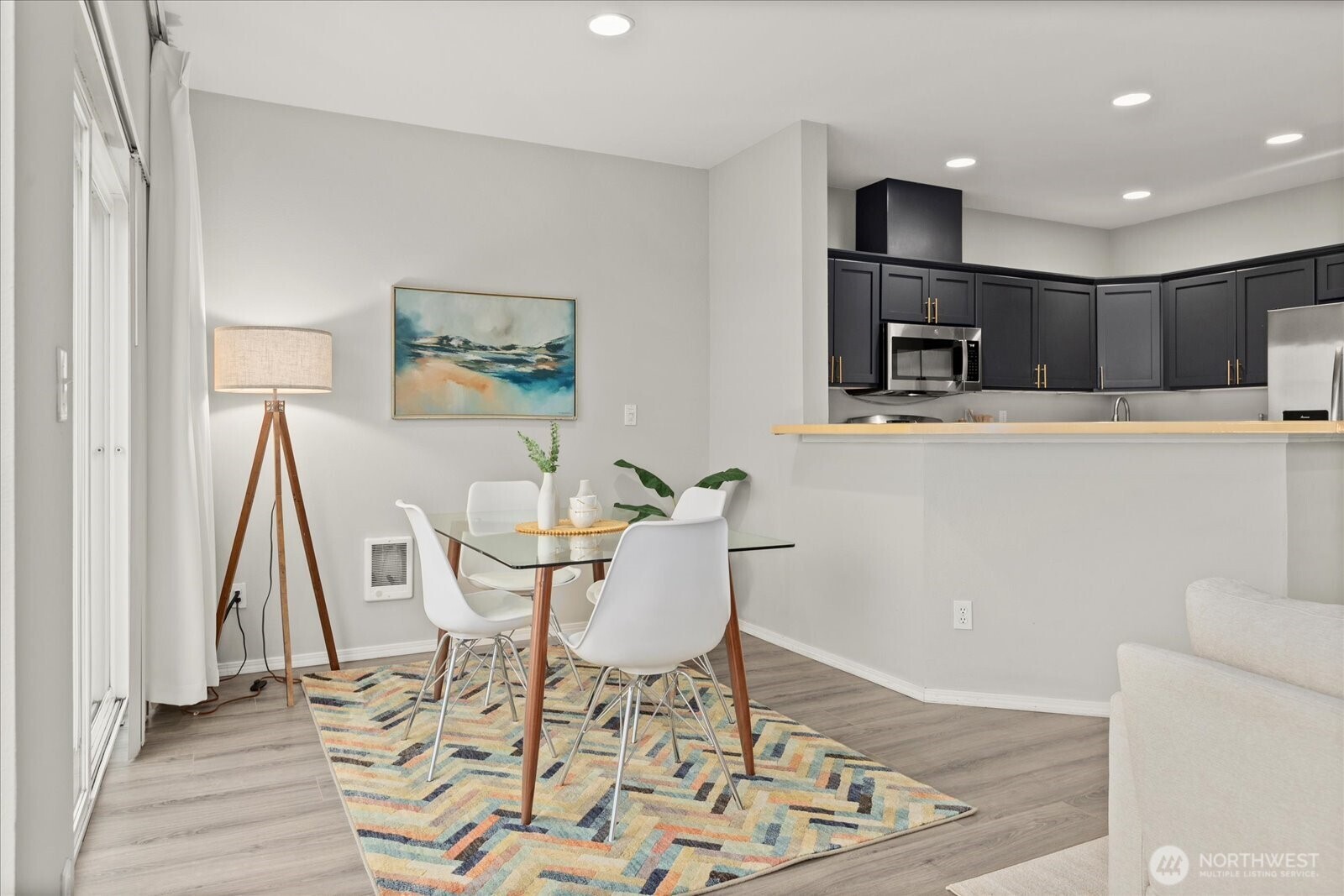 2325 Harbor Avenue Southwest, Unit B1 Seattle, WA 98126 - Photo 13 of 37 a view of a dining room with furniture and wooden floor