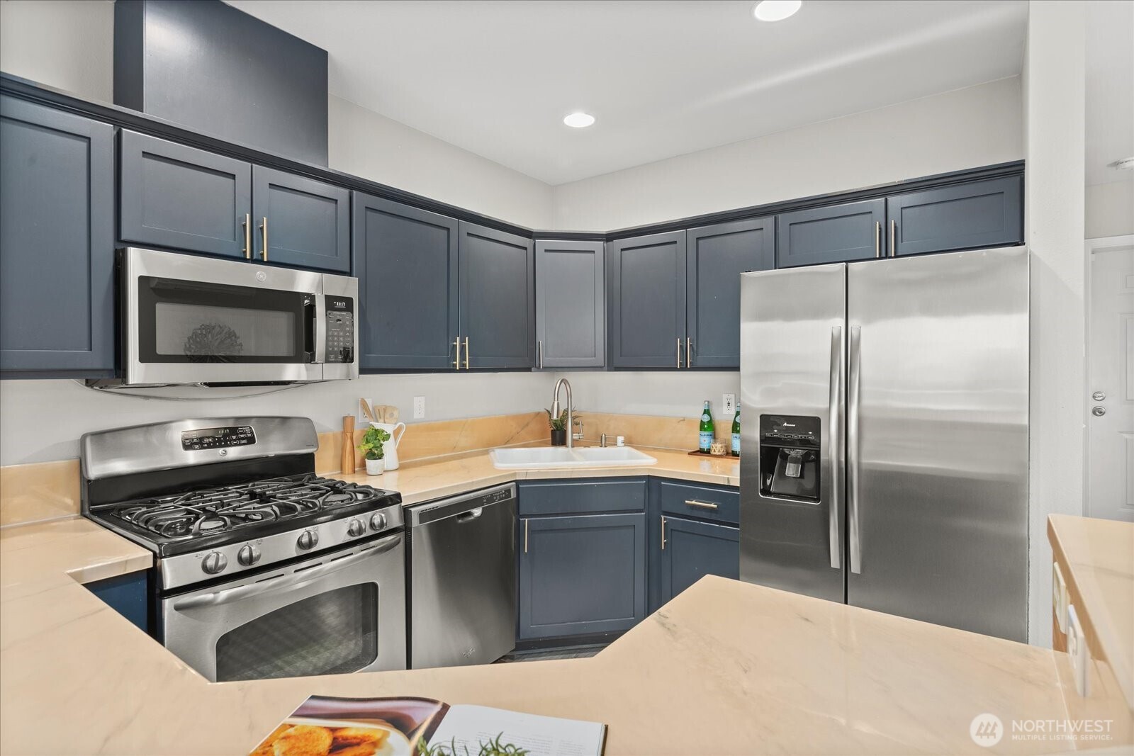 2325 Harbor Avenue Southwest, Unit B1 Seattle, WA 98126 - Photo 15 of 37 a kitchen with a sink stove and refrigerator