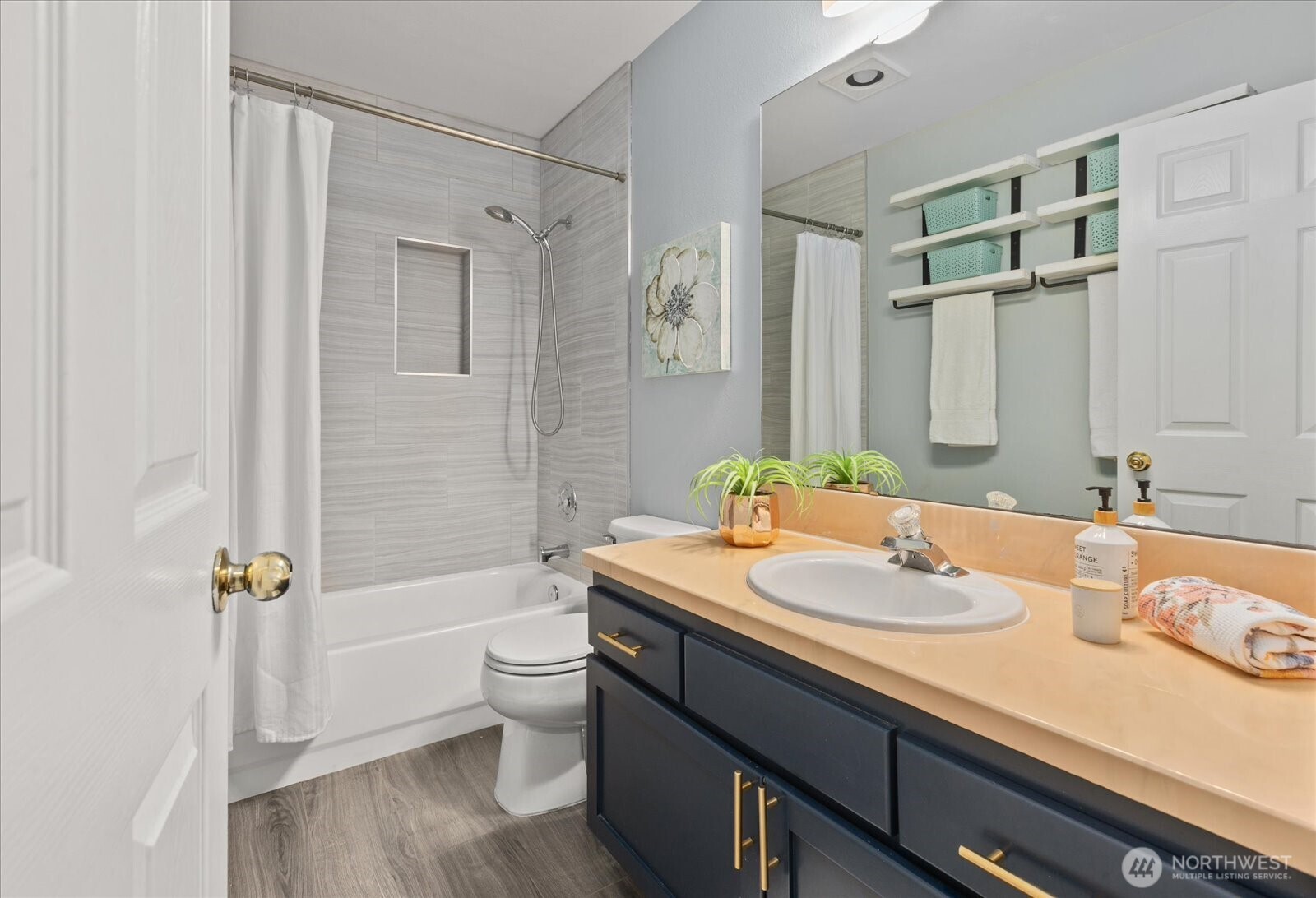 2325 Harbor Avenue Southwest, Unit B1 Seattle, WA 98126 - Photo 19 of 37 a bathroom with a sink a toilet and shower