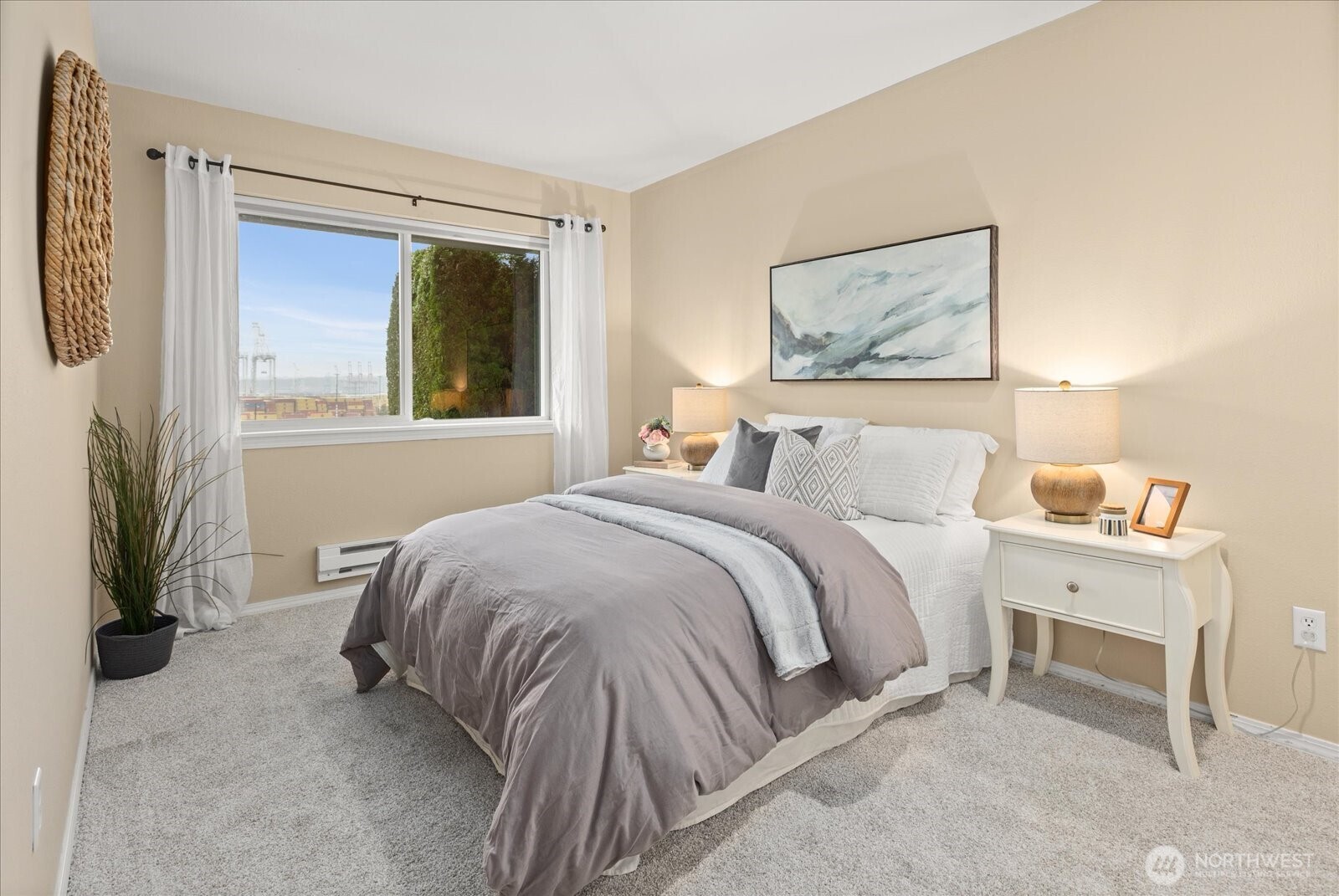 2325 Harbor Avenue Southwest, Unit B1 Seattle, WA 98126 - Photo 20 of 37 a bedroom with a bed and a painting on the wall