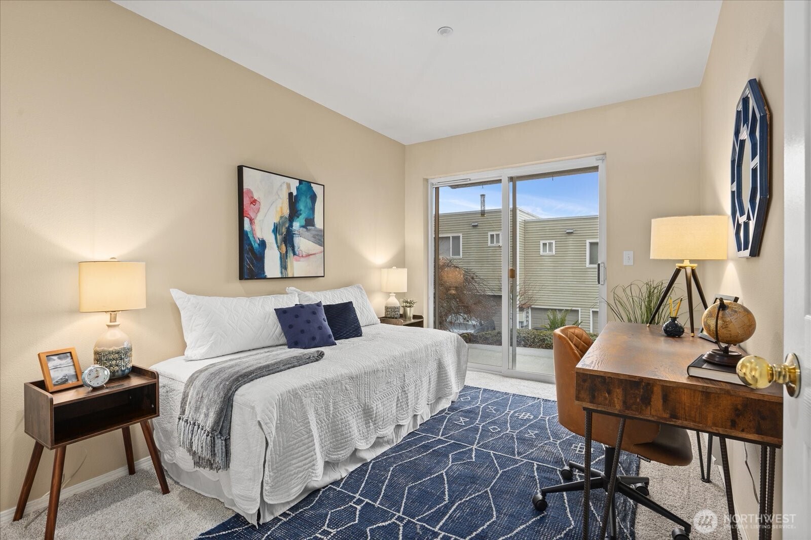 2325 Harbor Avenue Southwest, Unit B1 Seattle, WA 98126 - Photo 22 of 37 a bedroom with a bed and a lamp on table