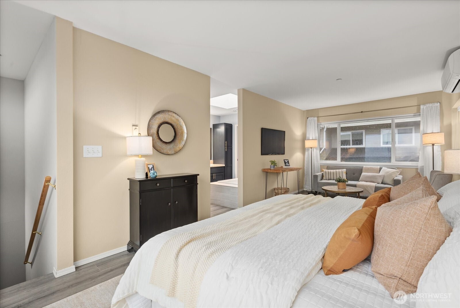 2325 Harbor Avenue Southwest, Unit B1 Seattle, WA 98126 - Photo 25 of 37 a bedroom with a bed and dresser with mirror