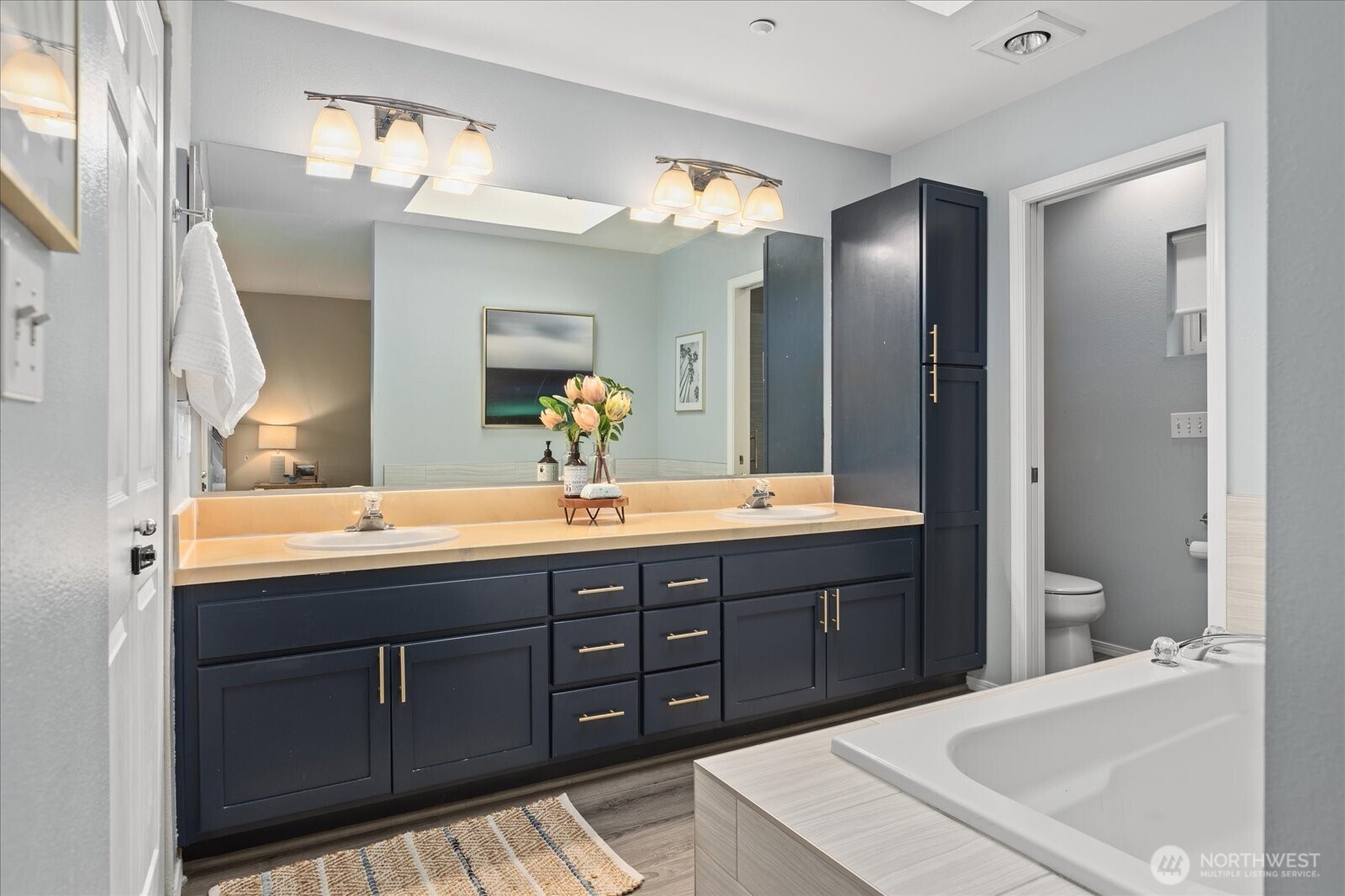 2325 Harbor Avenue Southwest, Unit B1 Seattle, WA 98126 - Photo 28 of 37 a bathroom with a tub sink and mirror