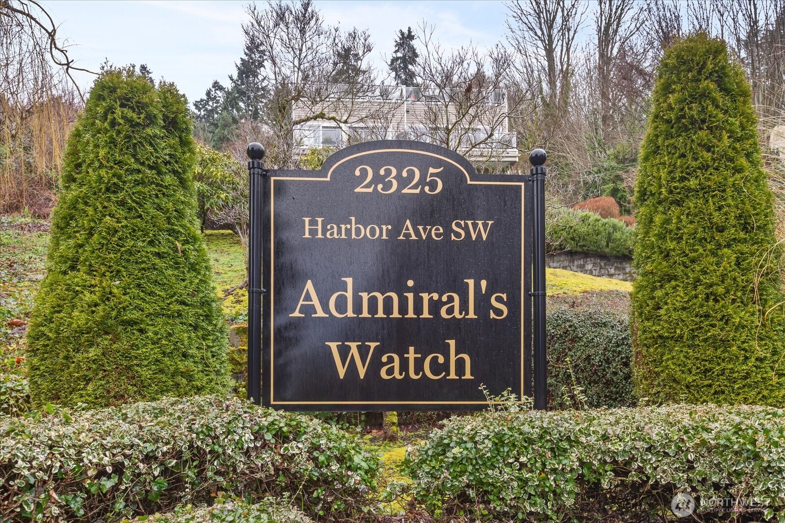 2325 Harbor Avenue Southwest, Unit B1 Seattle, WA 98126 - Photo 35 of 37 a sign broad in front of the red brick house