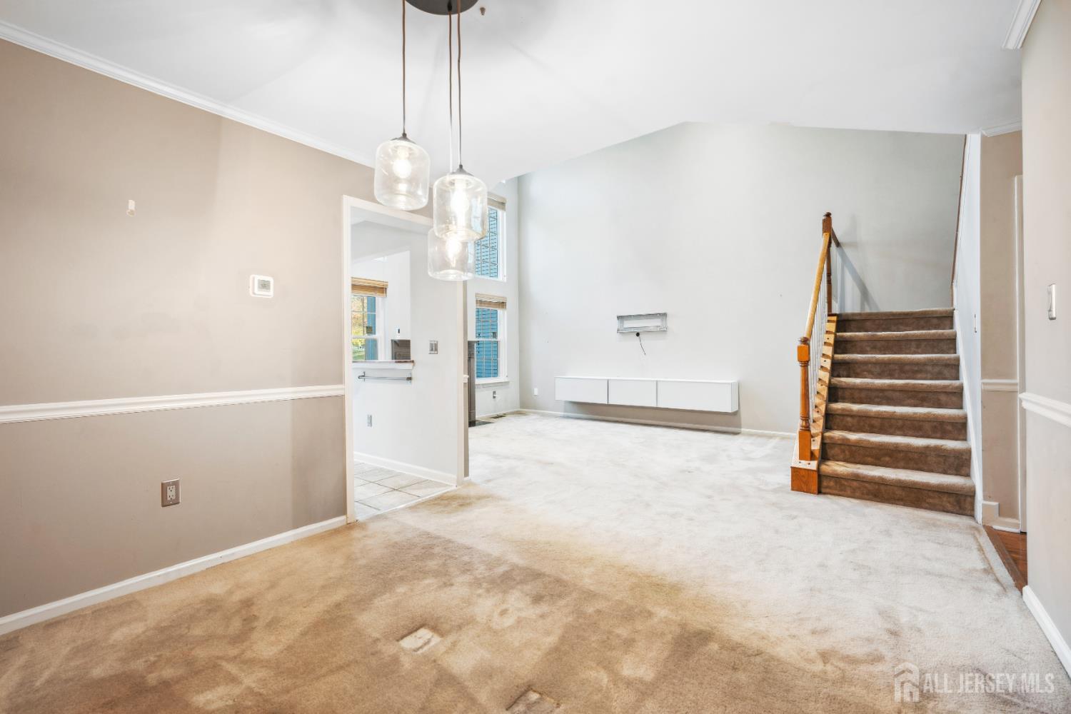 1907 Stech Drive Bridgewater, NJ 08807 - Photo 12 of 55 a view of an empty room with wooden floor and windows