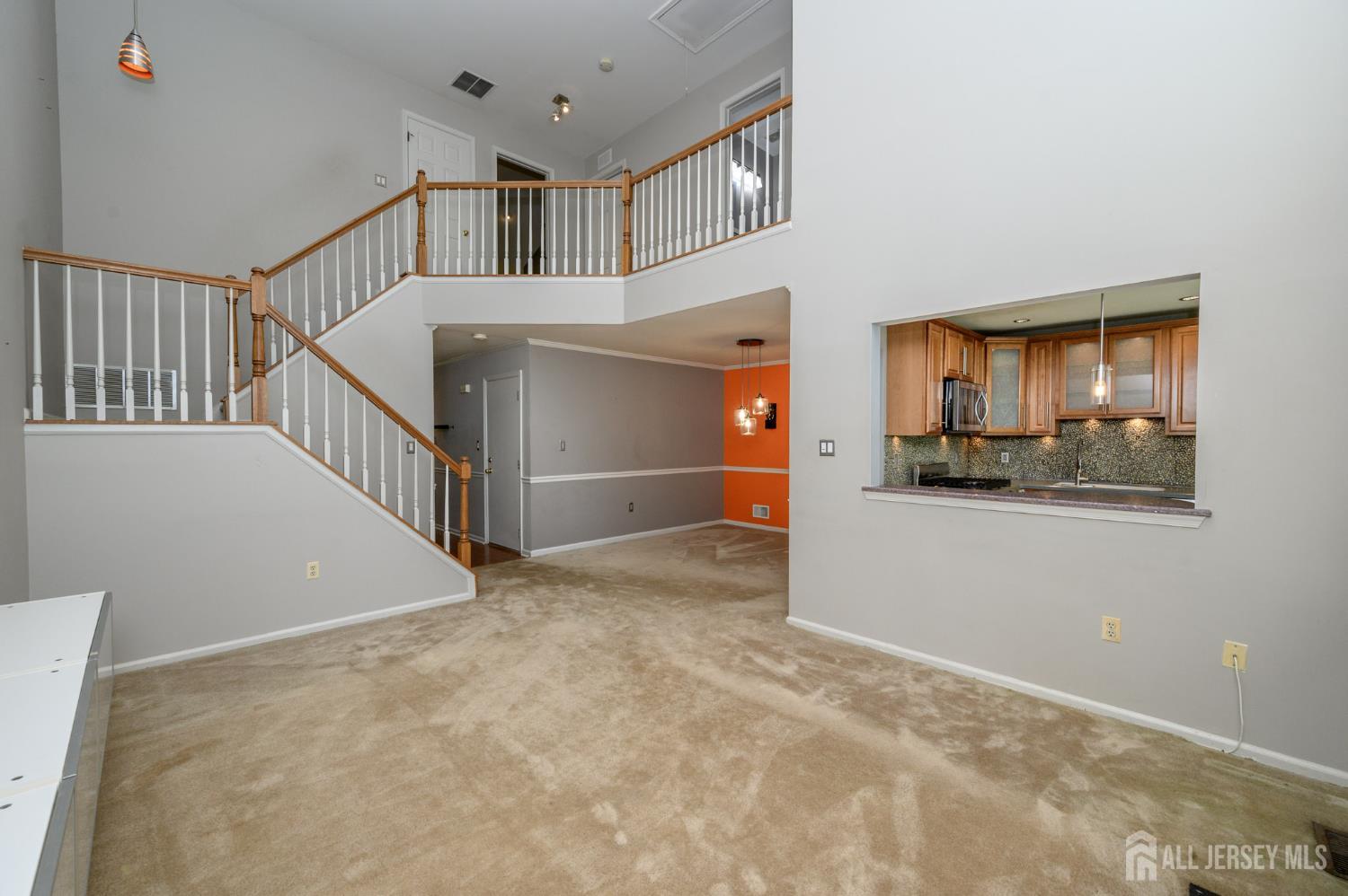 1907 Stech Drive Bridgewater, NJ 08807 - Photo 14 of 55 a view of hallway with stairs and a refrigerator